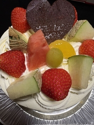誕生日ケーキを...